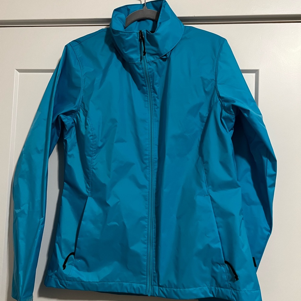 Light blue Cabelas Rain Swept Jacket with 4MOST REPEL and packable hood size M